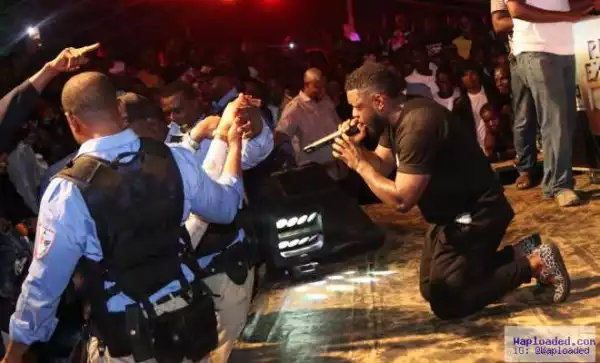 Photos: Singer Timaya Shocks Fans As He Kneels Down, Hugs, Prays & Thanks Them At A Show In PH